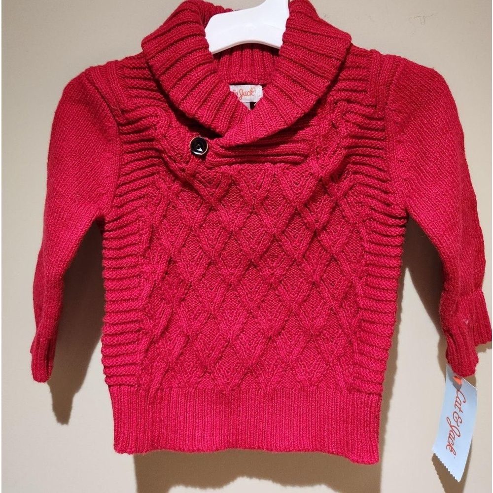 A baby bundle. 2 pair of footed Christmas pajamas and 1 red Christmas sweater